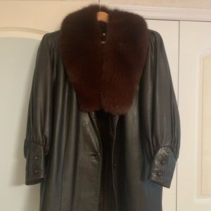 Woman’s leather coat with warm liner and fur collar. Size M